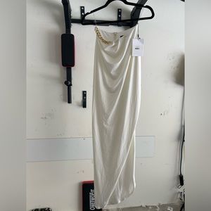 White nookie single shoulder dress with high slit opposite the shoulder